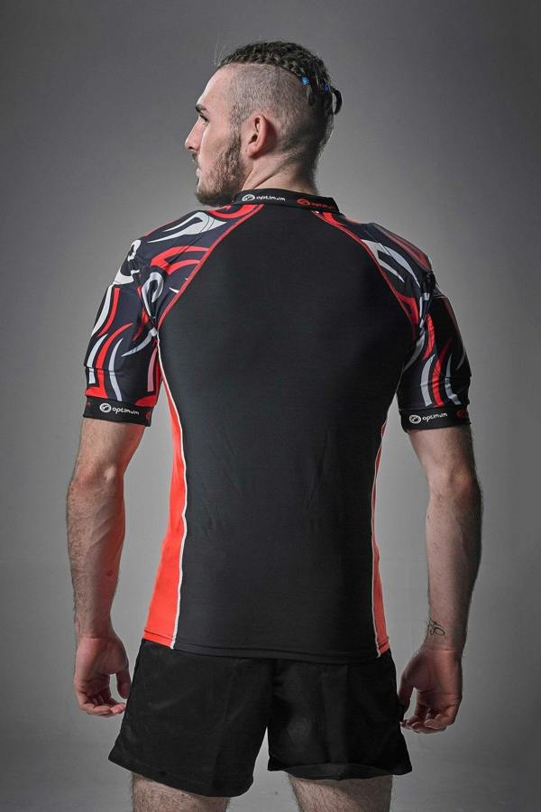 Black Optimum Razor protective top with red and white tribal-print shoulders, rear view on model - Optimum