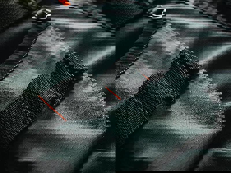 Scruffs Trade Flex Mens Pockets Cargo Shorts, close-up image showing durable fabric with a black strap and reinforced stitching.