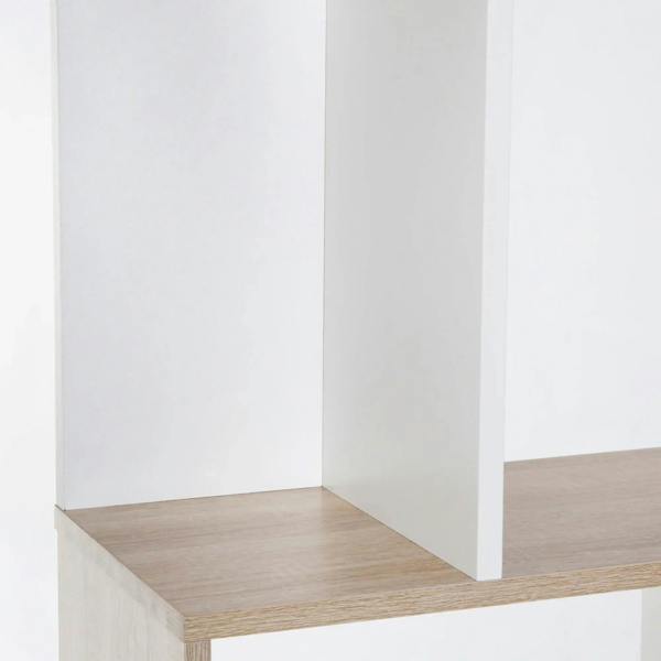 Close-up of lower shelf on S-shaped bookshelf with white side panels and oak base
