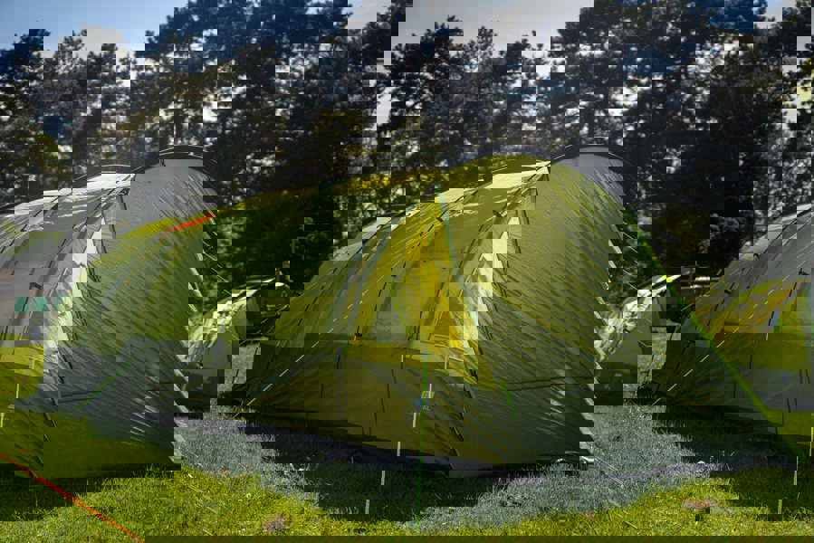 The Abberley XL 4 Berth Tent by OLPRO erected in a campsite with its doors closed.