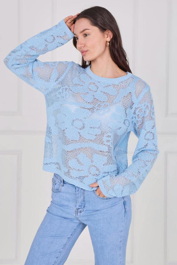 Model wearing a long sleeve crochet top with an open-knit pattern, styled with high-waisted jeans, featuring a relaxed fit and lightweight texture for casual everyday wear.