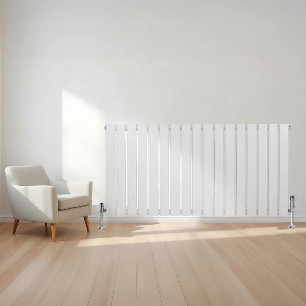 Flat white single column radiator, 600 x 1190mm, mounted on a wall with sleek vertical lines, complemented by a modern chair and wooden floor