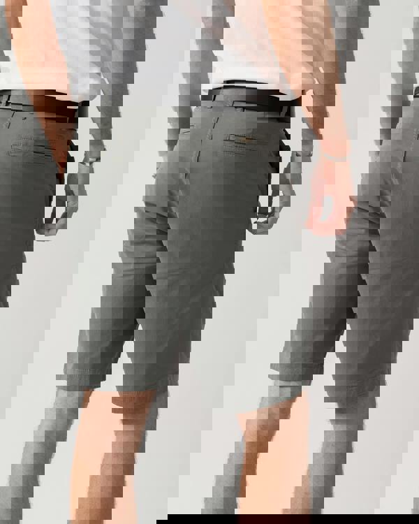 back shot of a model wearing a BOSS Green Paddy Mens Cotton-Piqué Polo Shirt with Contrast Logo in Open White 115