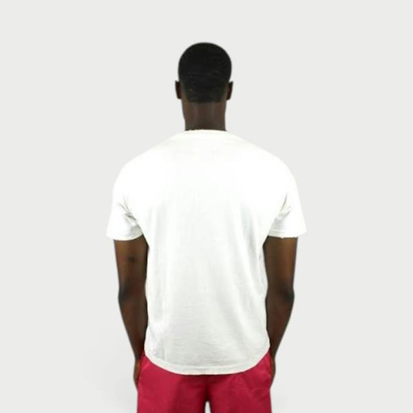 Supplied Fashion white vintage cotton t-shirt worn by a man, back view showing relaxed fit and worn-in texture.