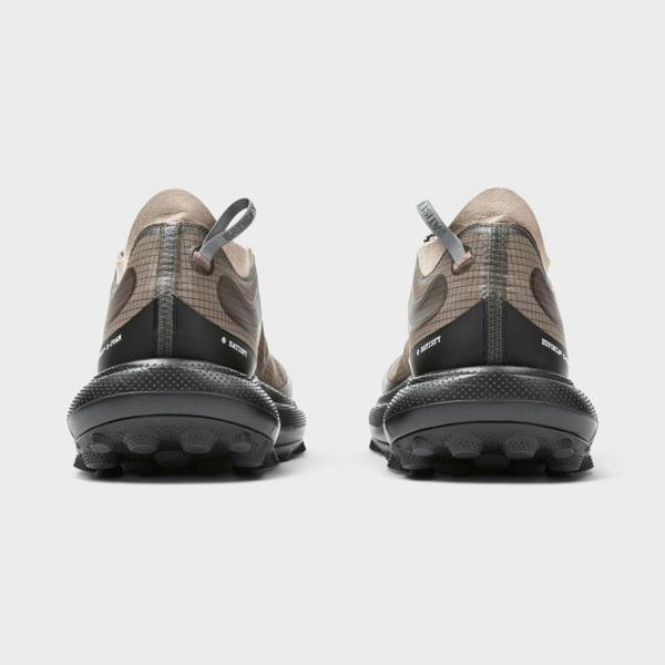 Supplied Fashion The Rocker sneakers in brown with a grid pattern, black textured sole, and rear pull tabs.