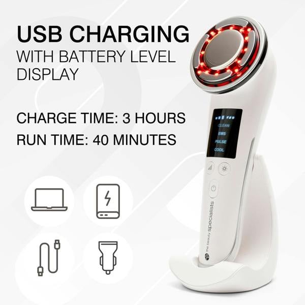 The Rio Face Lift & Tone Beauty Spa is a white handheld anti-aging device with red LED lights, a round head, and charging stand. Features USB charging, battery level display, 3-hour charge time, and 40-minute runtime for firmer-looking skin.