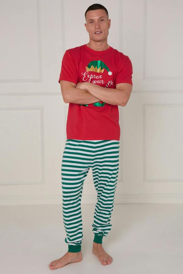 Person wearing a red Christmas-themed t-shirt and green striped pants on a white background