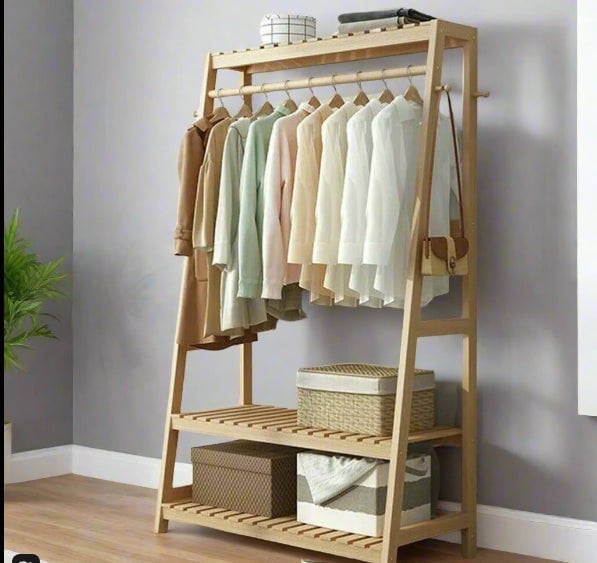 Garment stand with shoe storage shelves and ladder rails

