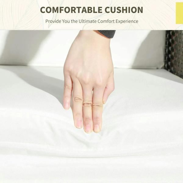 Cream seat cushion on a rattan chair with soft upholstery, close-up hand press