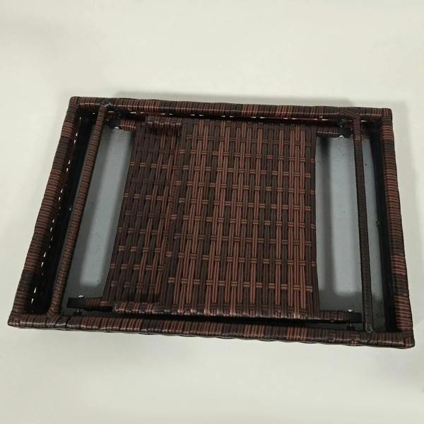 Brown woven rattan tabletop with dark metal support bars and folded frame
