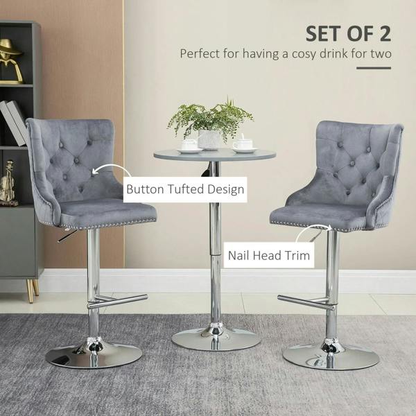 Set of 2 grey velvet bar stools with tufted backs, nailhead trim, and chrome pedestal base