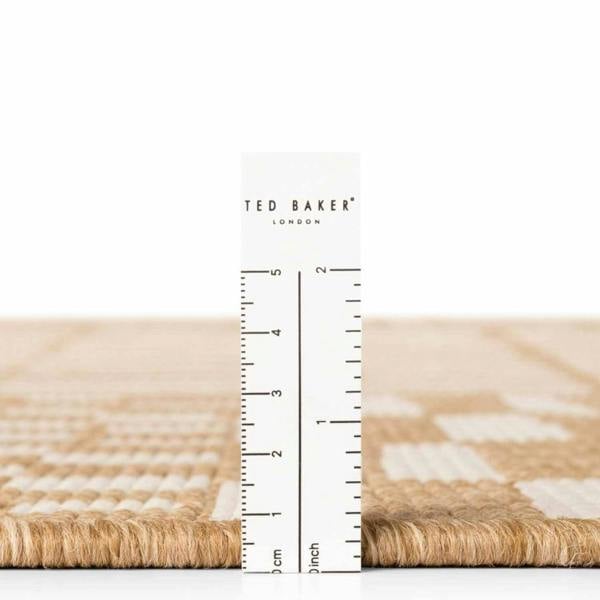 Ted Baker London rug with a ruler for scale on a white background
