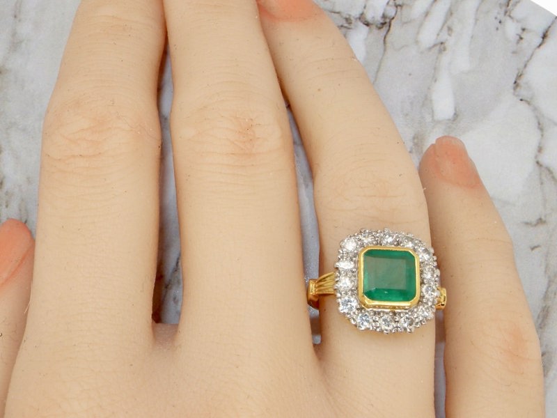 Vintage Tom A fine emerald and diamond cluster ring