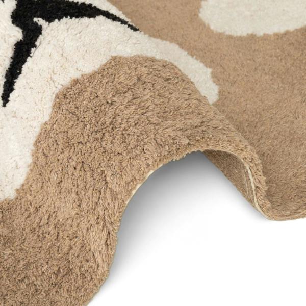 Close-up of a textured rug with geometric pattern on a white background