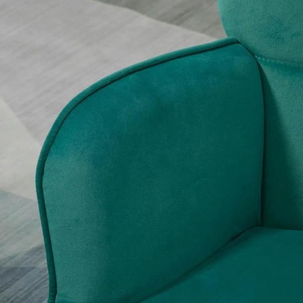 Green velvet wingback armchair with curved back and padded armrest