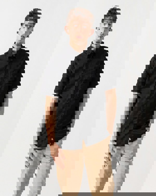 Model wearing a Belstaff Scale Mens Short Sleeve Shirt in Black