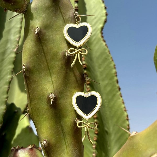 Heart and bow earrings in gold vermeil. Demi-fine luxury earrings by LENAE.