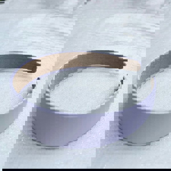 Lilac hairband, smooth satin finish, soft pastel purple shade, padded structure, minimalist elegant design, versatile everyday accessory
