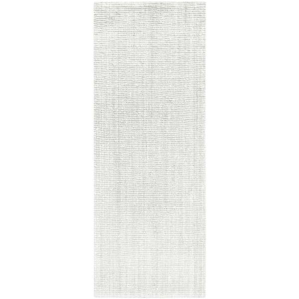Rectangular area rug with a subtle pattern on a plain background