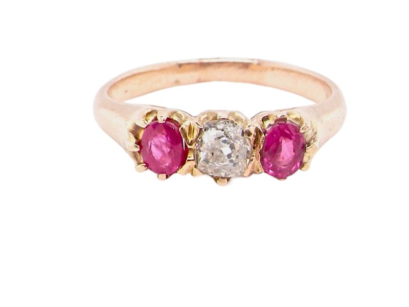 Vintage Tom A vintage three stone ruby and diamond ring