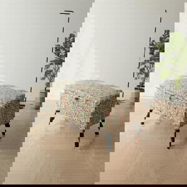 Ottoman storage bench doubling as a coffee table with decorative tray