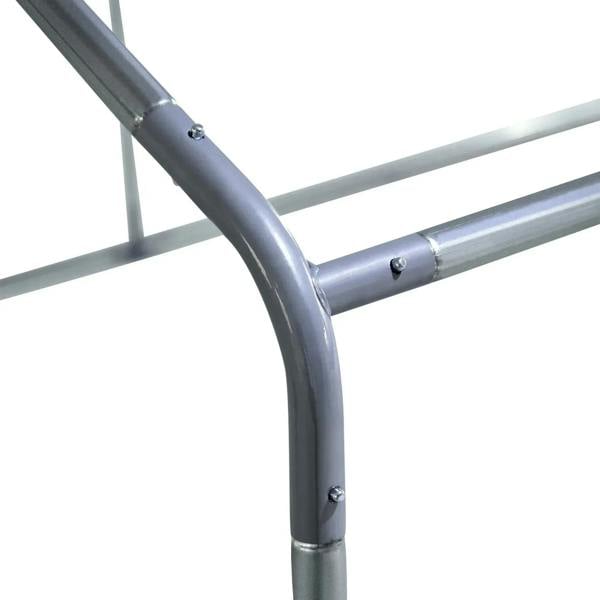 Gray metal coop frame tube joints with bolts and curved corner elbow