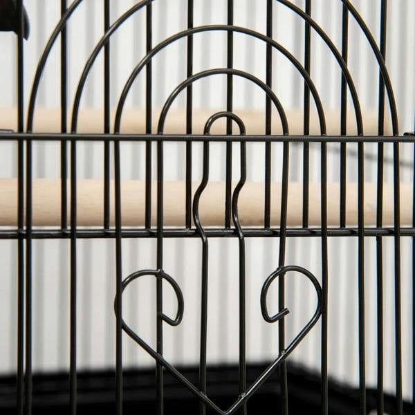 Black metal bird cage front with heart-shaped wire grille