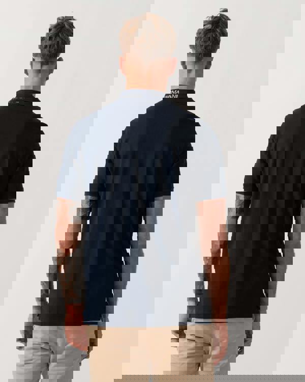 Model wearing Emporio Armani Mens Beach Polo in Armani Blue - Back