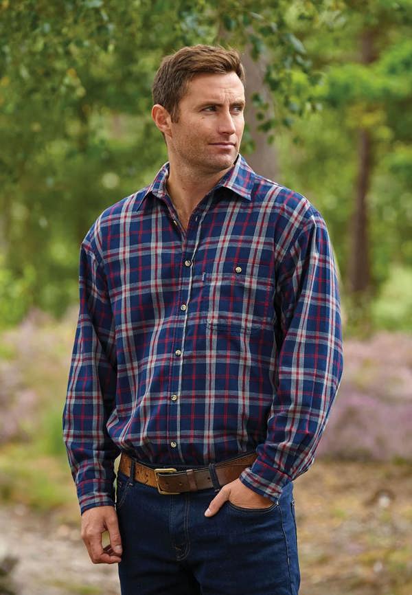 Man weraing Champion Stroud fleece shirt showing soft brushed fleece texture, button pocket & classic country check pattern