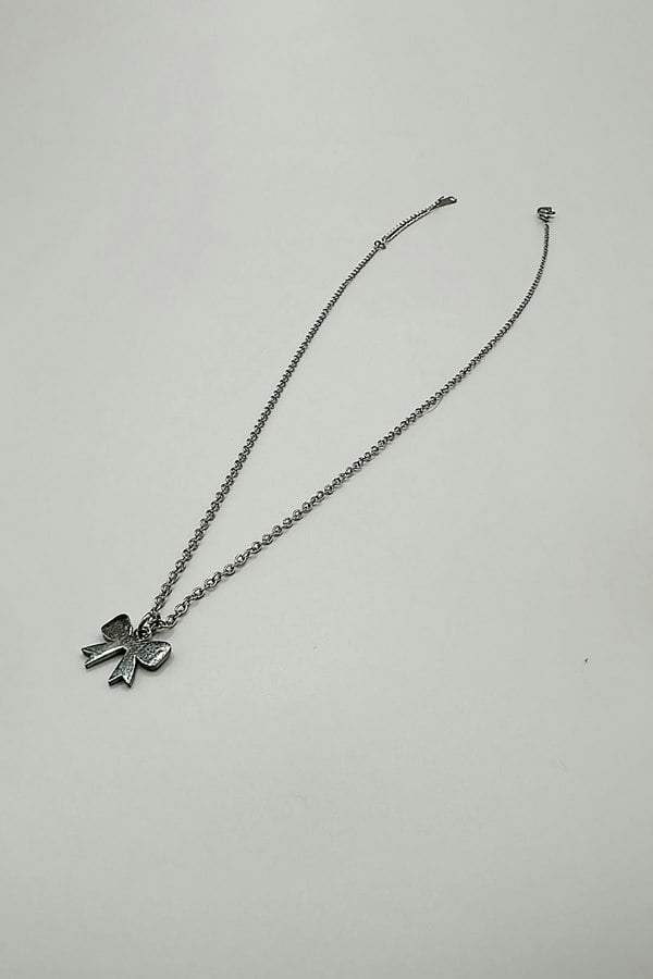 SVNX Mini Bow Pendant Necklace in Silver