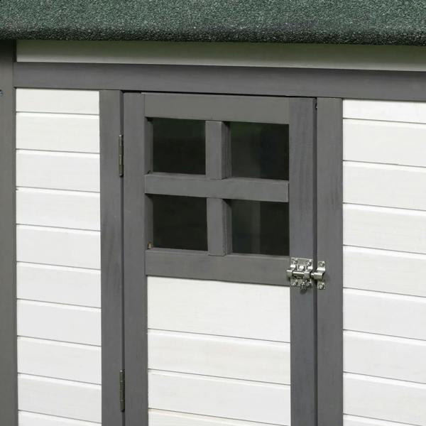 Grey coop door with metal latch and vented panel on the front nesting entrance.