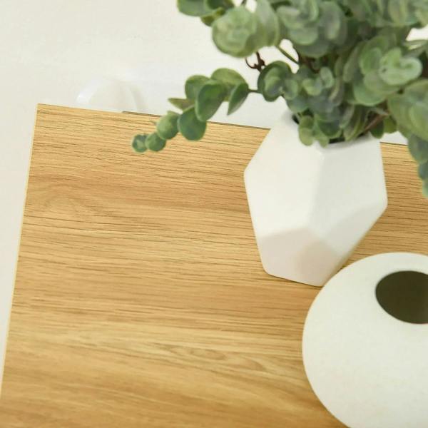 Light wood top surface of white shoe cabinet