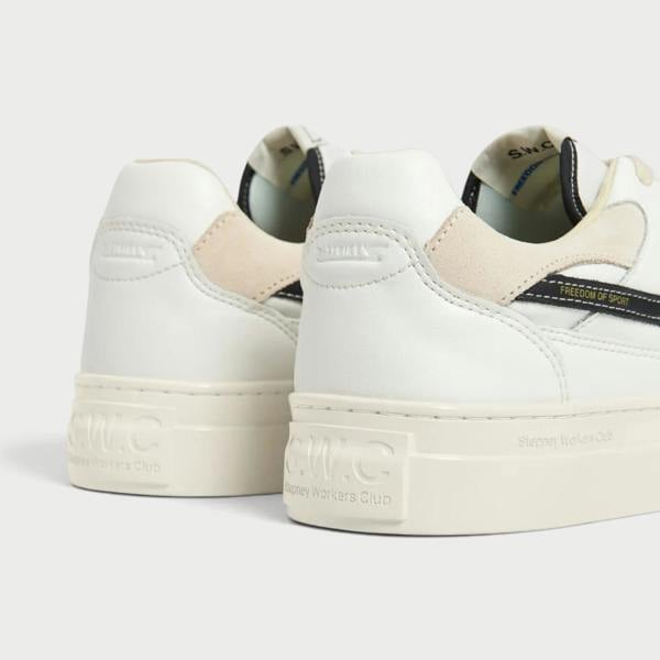 Supplied Fashion Pearl S-Strike white leather sneakers with black detailing and cream rubber soles, rear view.
