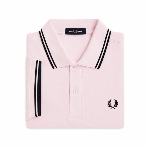Iced pink Fred Perry cotton polo shirt with navy twin tipped collar and cuffs and embroidered laurel wreath logo.