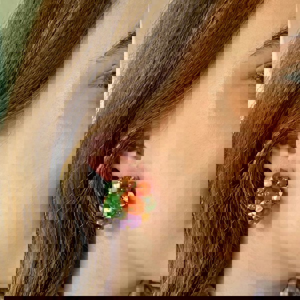 Colourful clip-on earrings, cluster bead design, orange green purple and pearl beads, gold-tone accents, bold statement jewellery, vintage-inspired accessory
