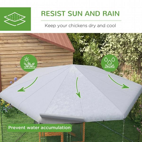Chicken coop run with grey fabric roof canopy over chain-link wire enclosure