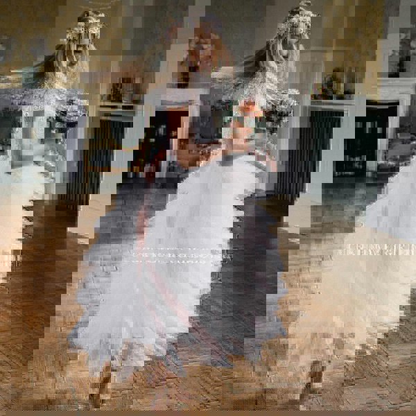 Girl dancing in flower girl dress