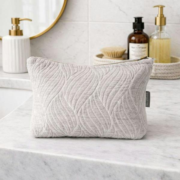 Light gray quilted leaf-pattern toiletry bag pouch with gold zipper pull