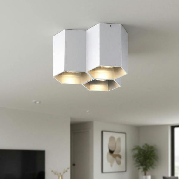 silver ceiling mount light fixture shown on a ceiling in modern house
