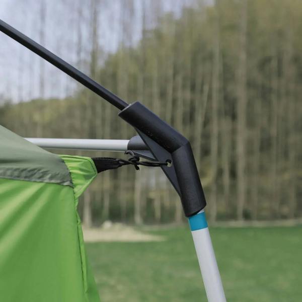 Green and black tent pole connector at the corner of a tunnel camping shelter