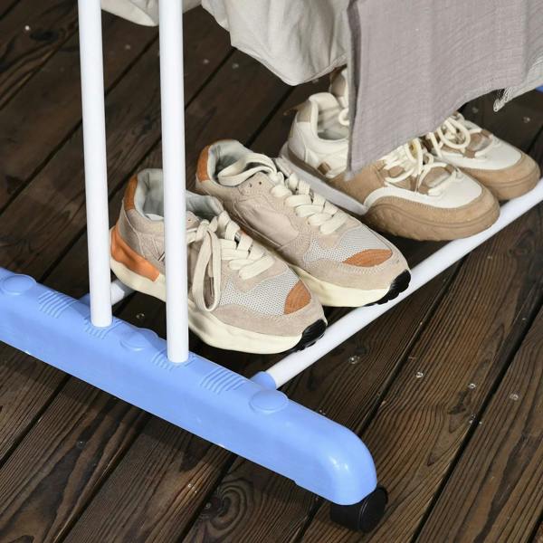 Foldable drying rack with blue base holding shoes on the lower shelf.