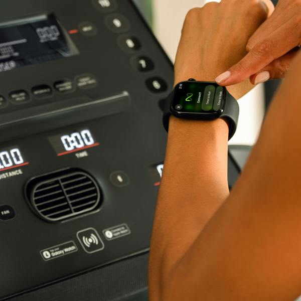 Apple Watch being connected to the BowFlex T6 treadmill using NFC.