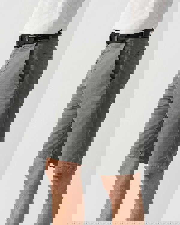 side shot of a model wearing a BOSS Green Paddy Mens Cotton-Piqué Polo Shirt with Contrast Logo in Open White 115