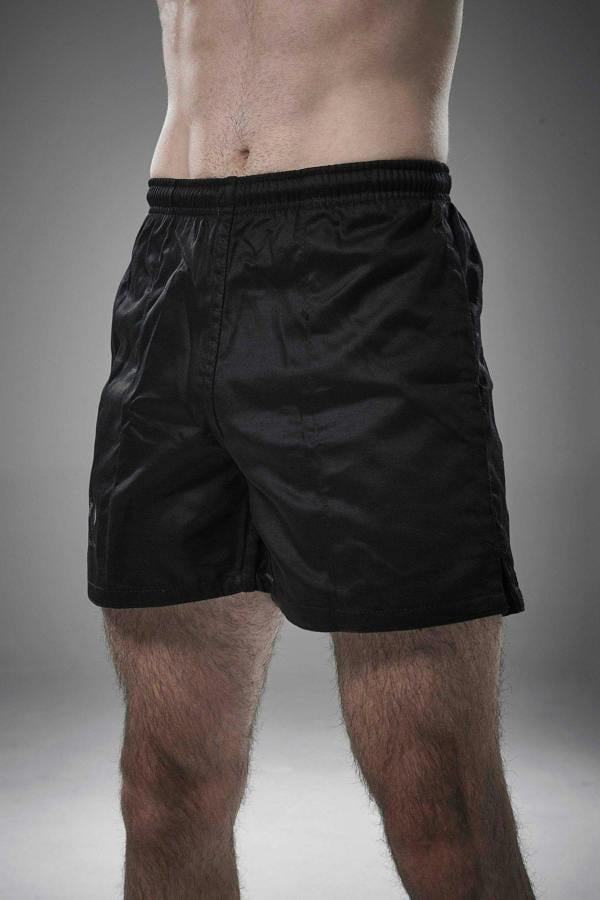 Man wearing black Optimum Auckland rugby shorts, front view on grey studio background - Optimum