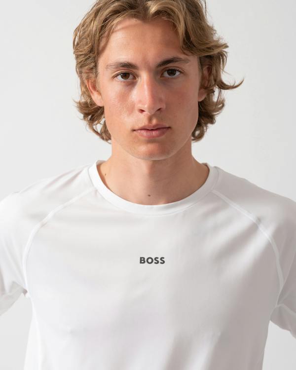 close up shot of a Model wearing a BOSS Green Tee Active Mens T-Shirt in White 100