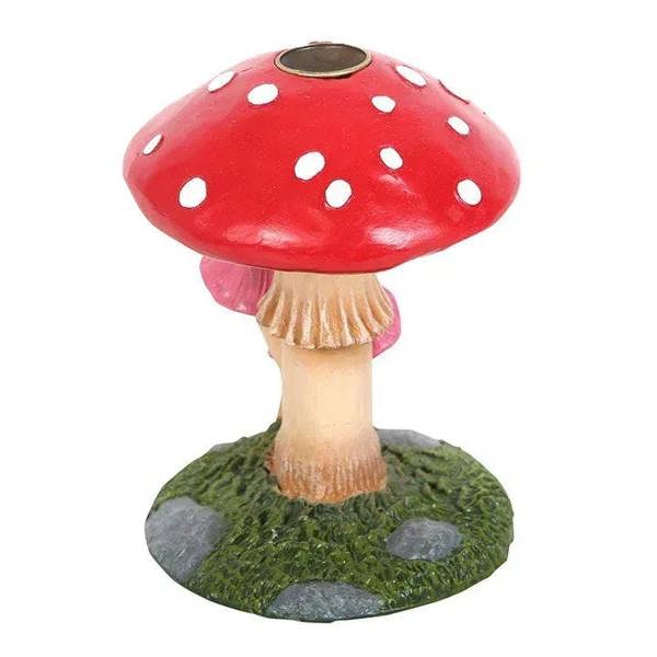 Red polka-dot mushroom incense burner with metal center dish and textured green base