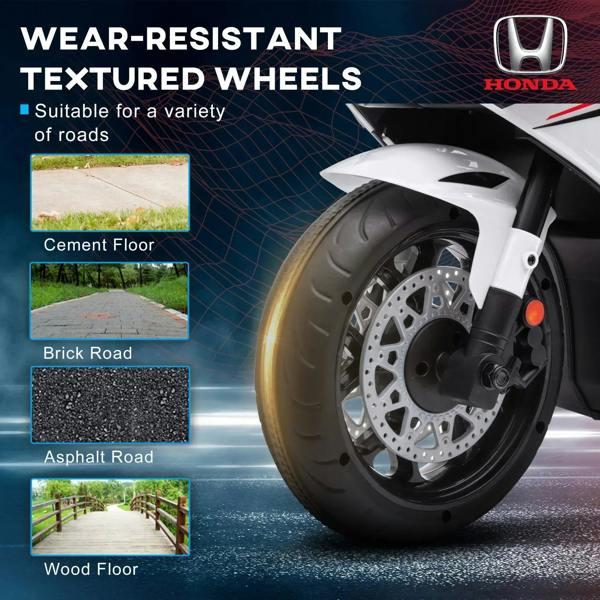 Front wheel and fork of white kids ride-on motorcycle with textured tire tread