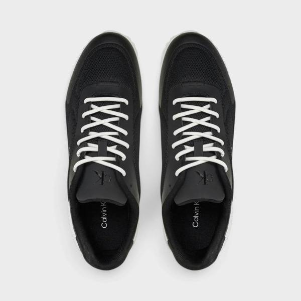 Supplied Fashion Calvin Klein Eva Runner low-top sneakers in black mesh and leather with white laces, top-down view.