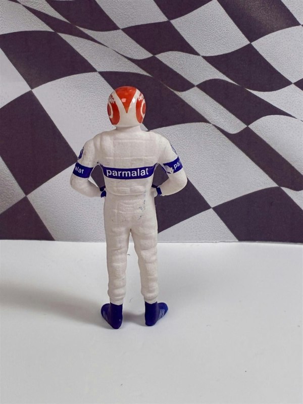 a toy figure of a man wearing a helmet