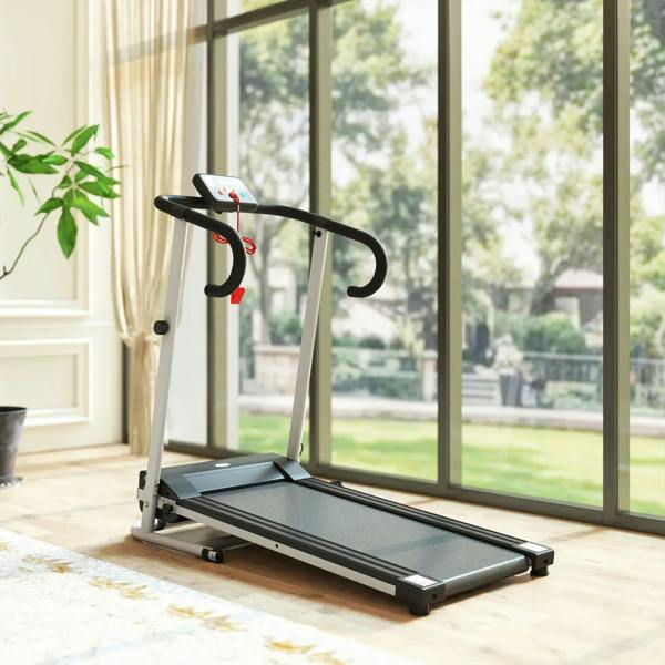 Folding treadmill with LCD console, grey running belt and side handles on floor